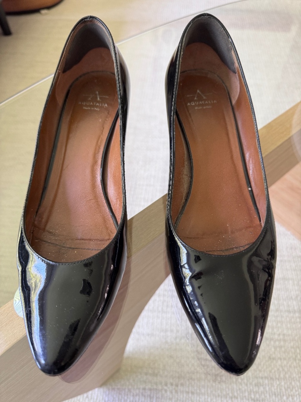 Aquatalia black patent leather pumps